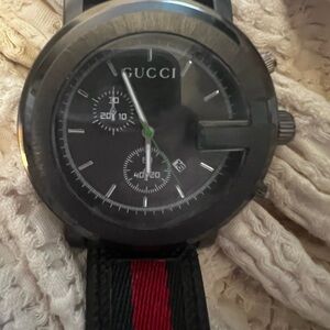 Copy Black Watch with Red and Green Strap. Needs battery. Super cute